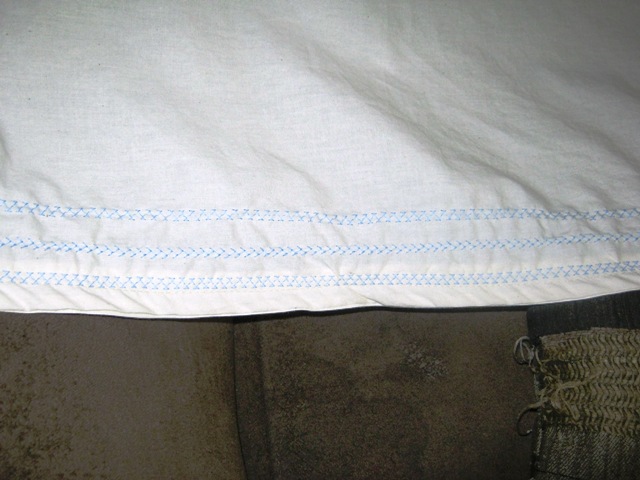 I used some decorative stitches on my sewing machine and some light blue 